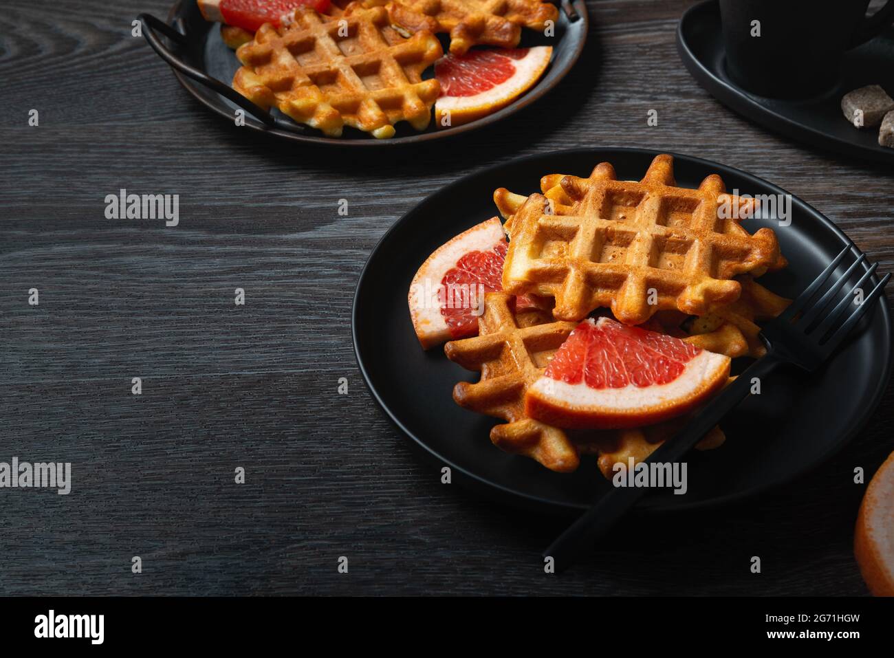 Waffle breakfast with grapefruit and coffee. Copy space Stock Photo Alamy