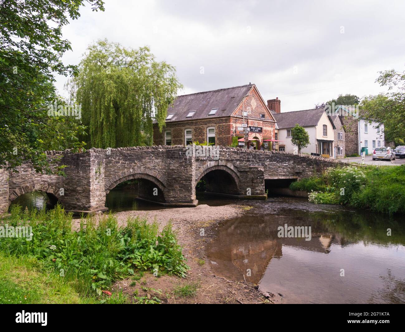 14thc packhorse Clun Bridge over the River Clun in Clun small village with popular Post Card cafe  in Shropshire Hills Area of Outstanding Natural Bea Stock Photo