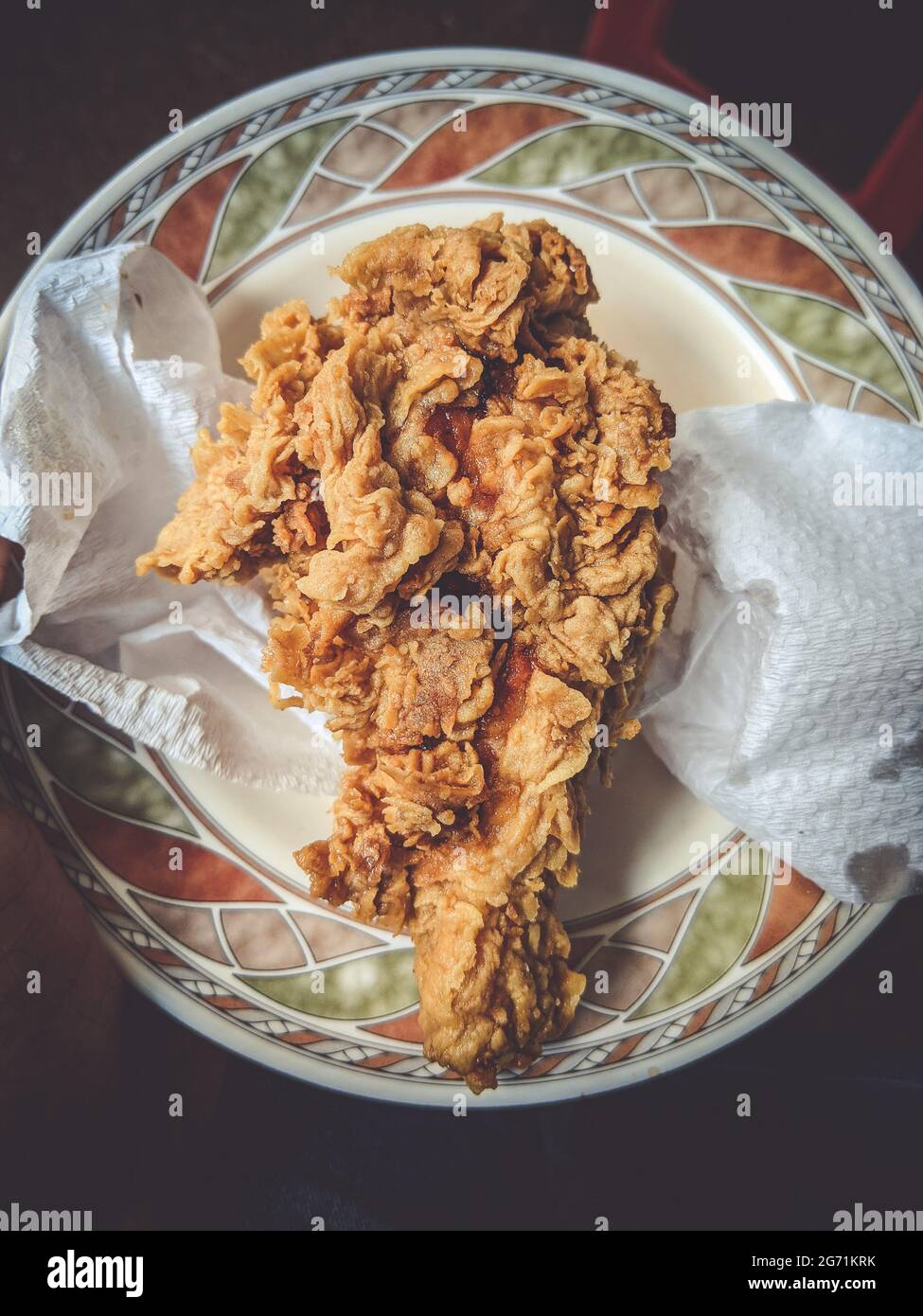 Top view of a newly cooked fried chicken served on a plate Stock Photo