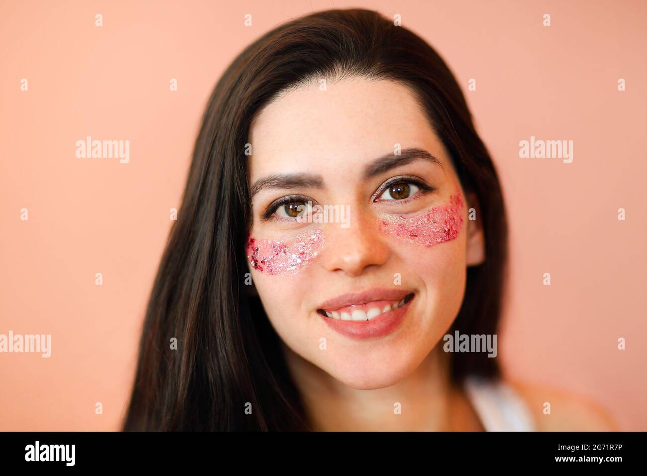 Positive young female with eye patches and looking at camera