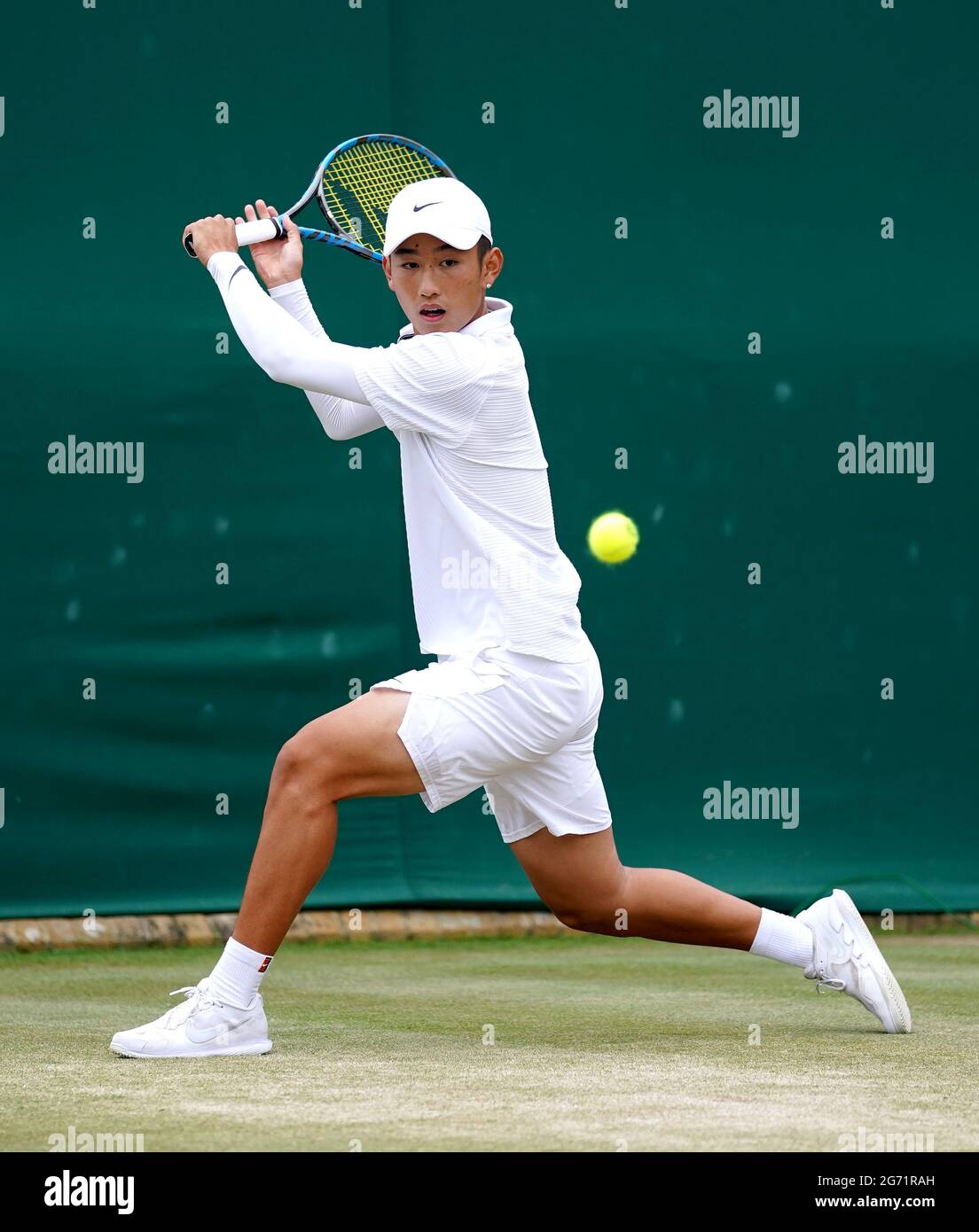 Shang Juncheng in action during his boys' singles semi-final match against Victor  Lilov on court 18 on day twelve of Wimbledon at The All England Lawn Tennis  and Croquet Club, Wimbledon. Picture