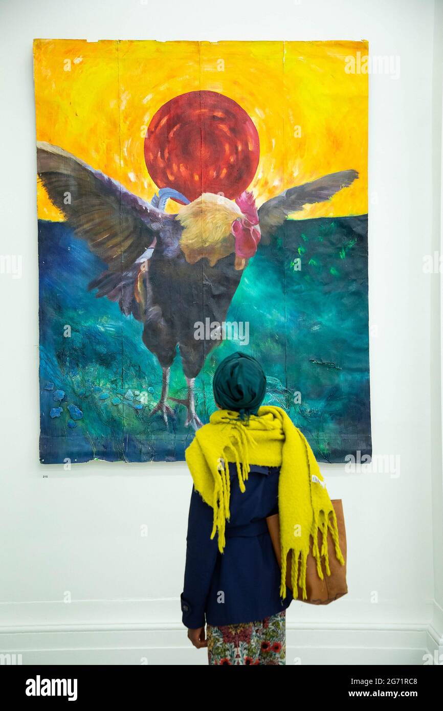 EDITORIAL USE ONLY Young artists and visitors view works at the opening ...
