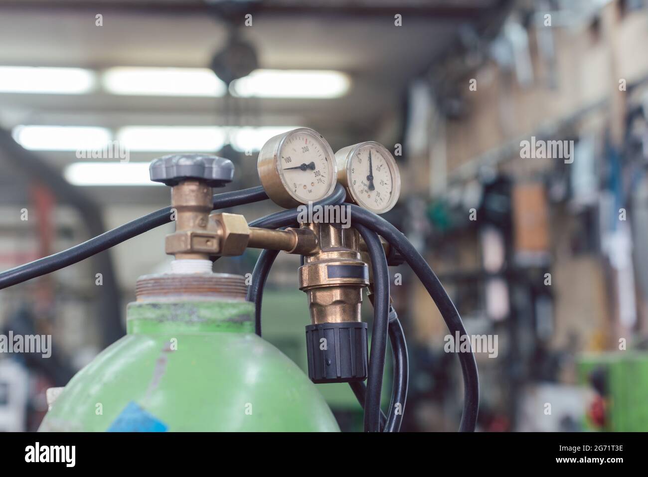 Gauge and valve on top of tanks for welding gas in metal Stock