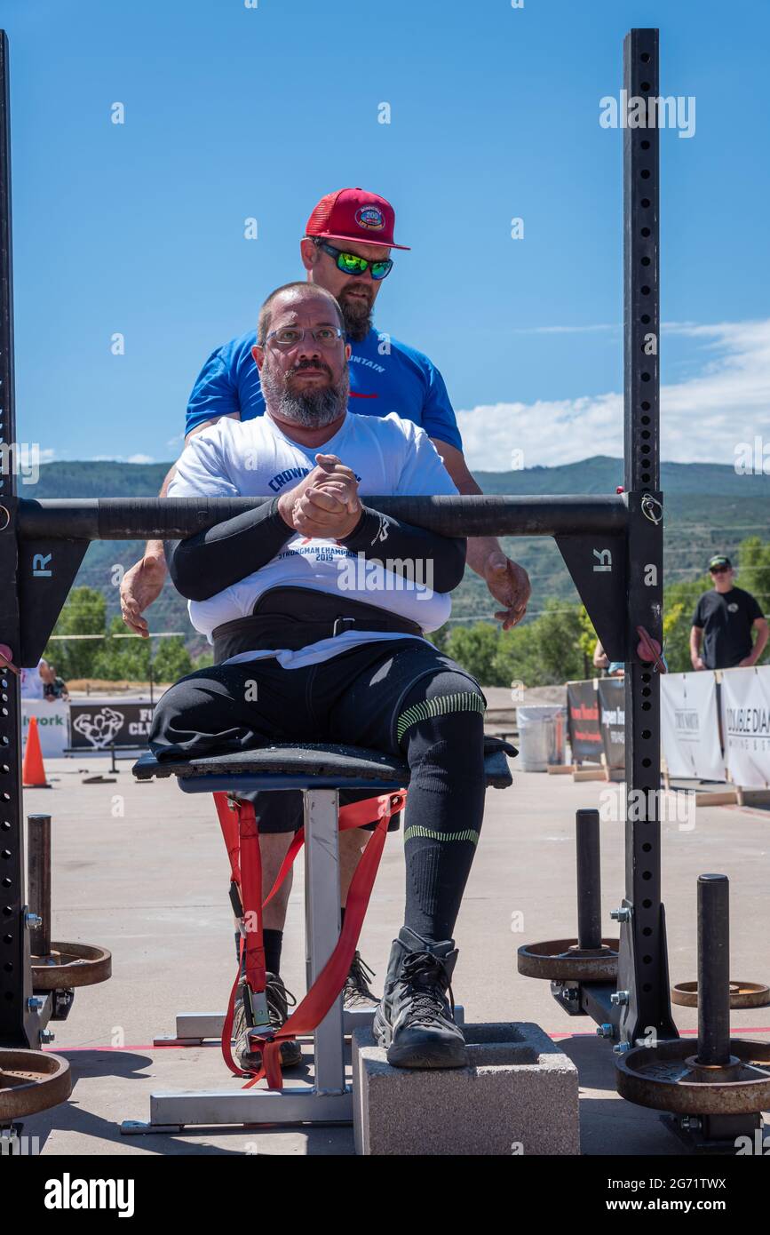 A disabled weightlifter competes as an adaptive athlete in the Crown Mountain Strongman Championship in Carbondale, Colorado. Stock Photo