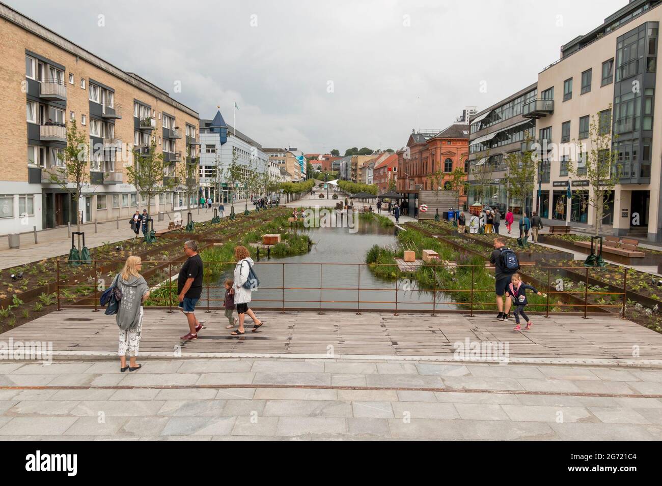 Randers, Denmark - 10-July-2021: The new rainwater basin at Ostervold in Randers, People look at flowers and nature, street resturant. Stock Photo