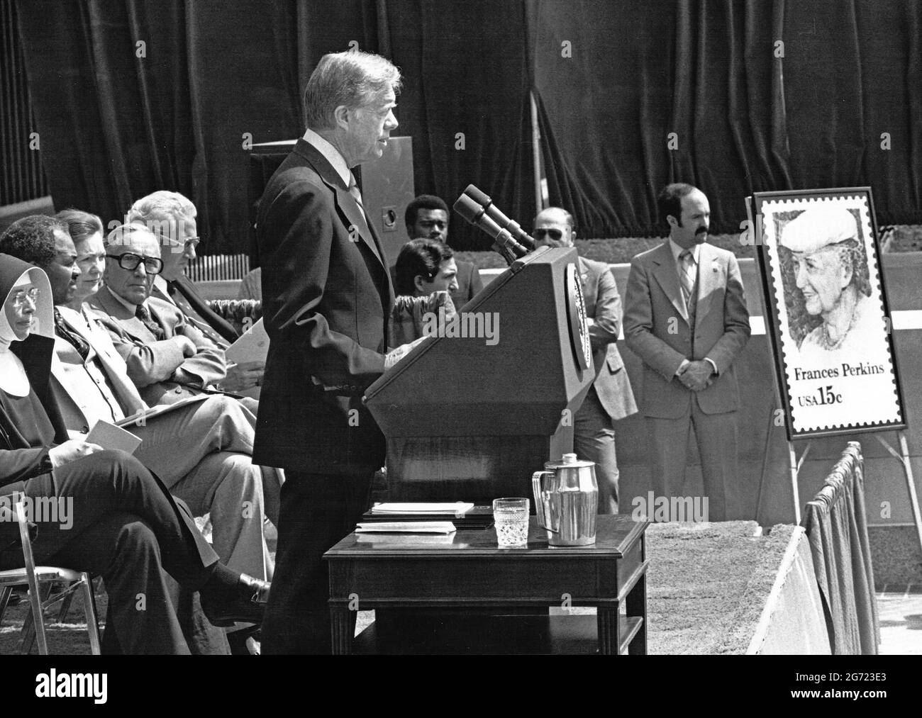 United States President Jimmy Carter speaks at the dedication of the new Frances Perkins Labor Building in Washington, DC on Thursday, April 10, 1980. Ms. Perkins was the first female Cabinet member in US history when US President Franklin Delano Roosevelt appointed her as US Secretary of Labor. Pictured at far right is the poster of a new fifteen cent stamp that will bear Ms. Perkins likeness. Credit: Benjamin E. 'Gene' Forte / CNP Stock Photo