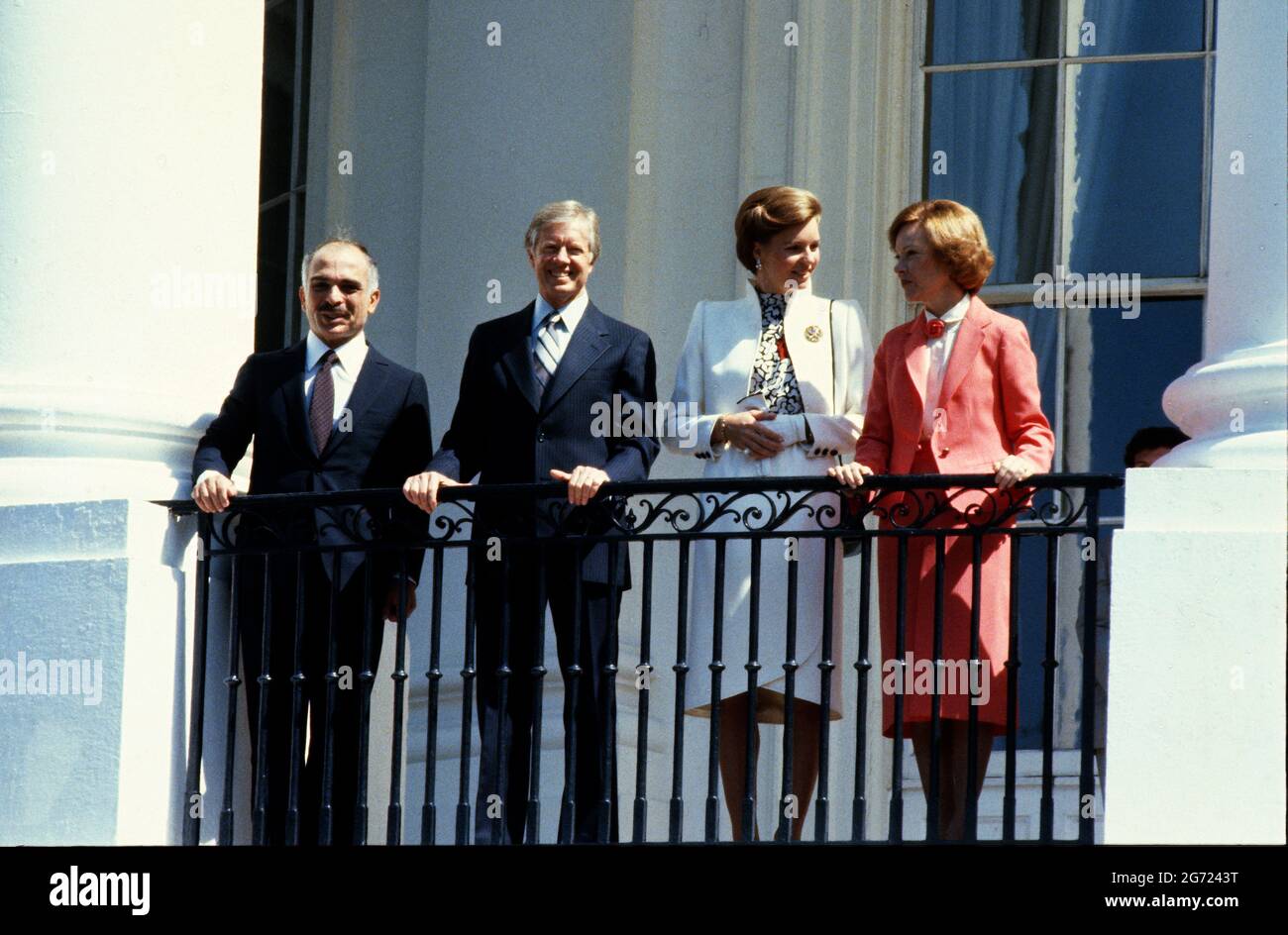 United States President Jimmy Carter, left center, and King Hussein I of Jordan, left, appear on the Blue Room Balcony at the conclusion of the State Arrival ceremony on the South Lawn of the White House in Washington, DC on 17 June, 1980. At center right is Queen Queen Noor al-Hussein of Jordan and at right is first lady Rosalynn CarterCredit: Benjamin E. "Gene" Forte/CNP Photo via Credit: Newscom/Alamy Live News Stock Photo
