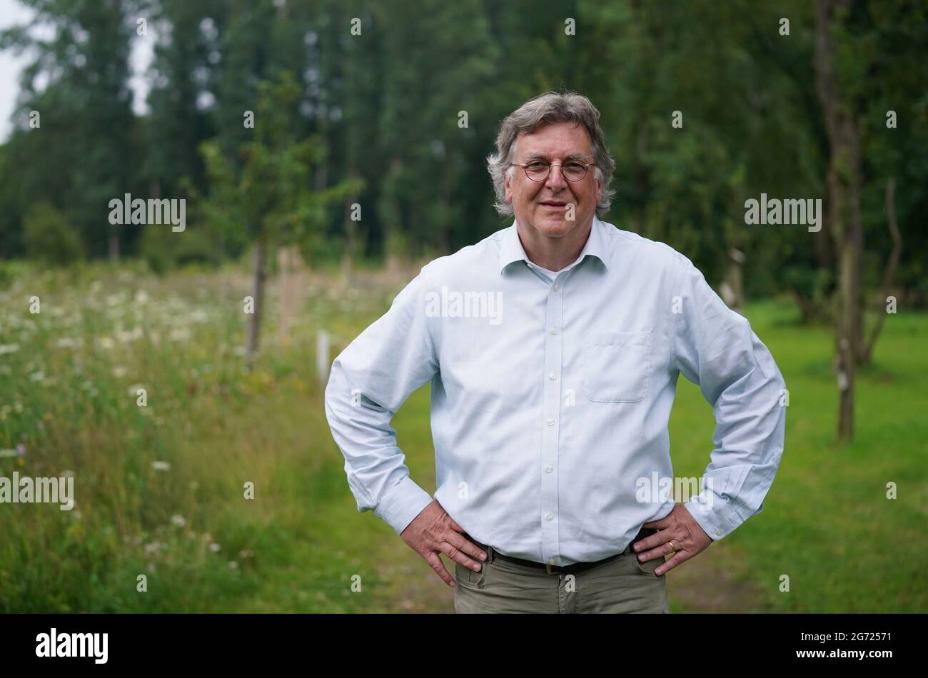 09 July 2021, Hamburg: Uwe Frommhold, COO Head of Operations at Anschutz Entertainment Group Germany, stands in front of a tree planting campaign in the Fame Forest. Photo: Marcus Brandt/dpa Stock Photo