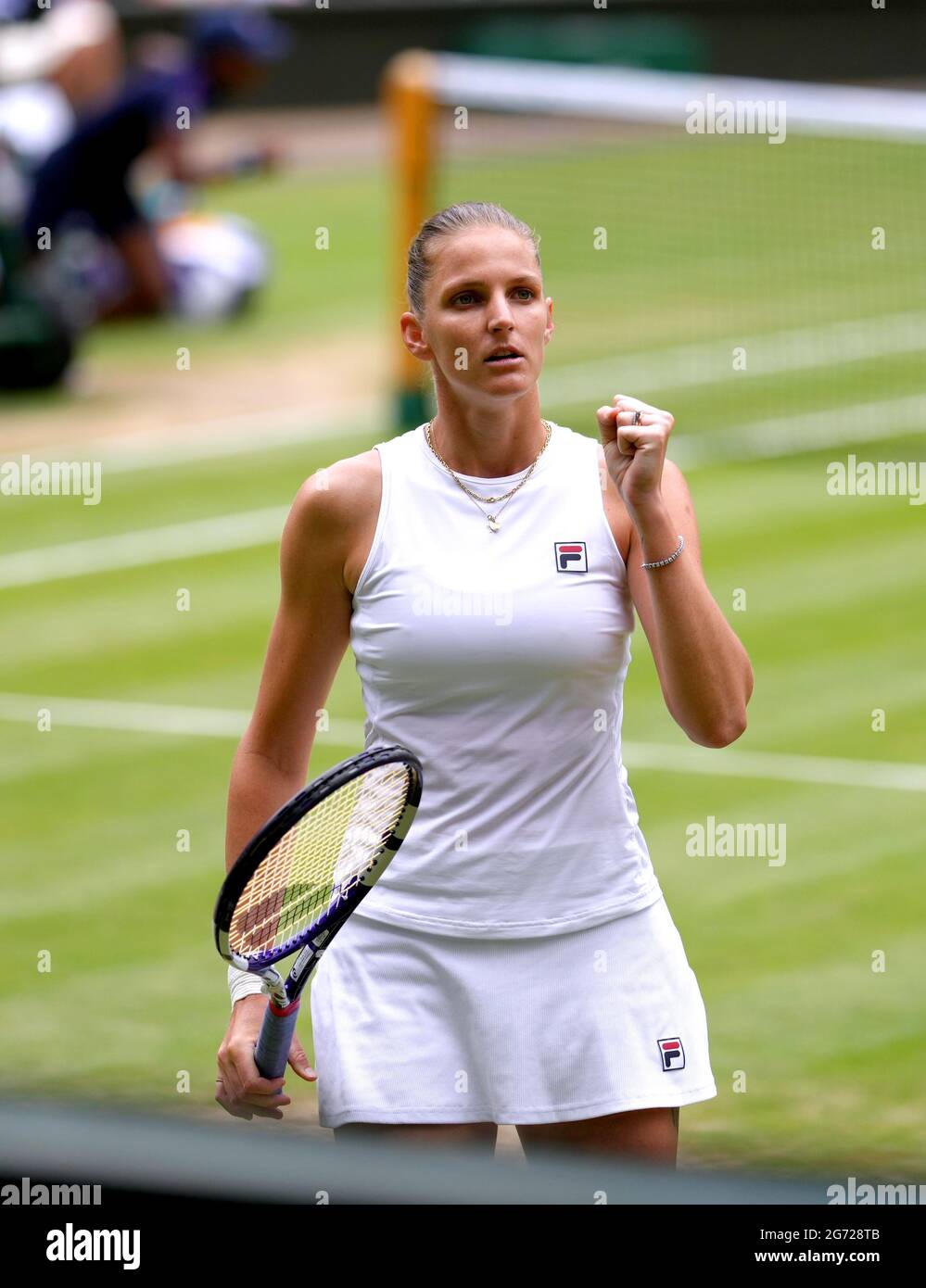 Karolina Pliskova celebrates after taking the second set to a tie break  during her ladies' singles final match against Ashleigh Barty on centre  court on day twelve of Wimbledon at The All