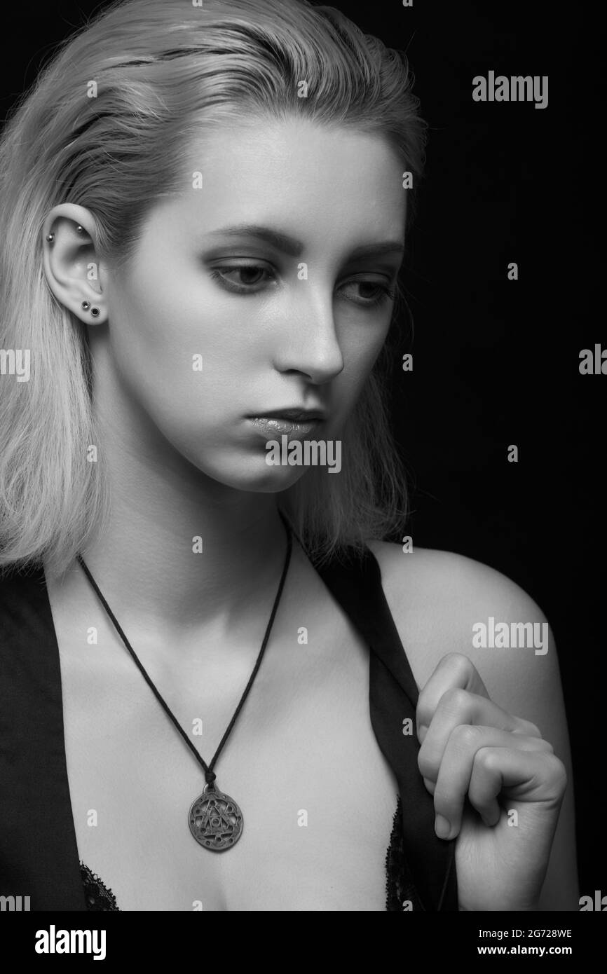 sad woman crying, looking aside on black background, closeup portrait,  profile view, monochrome Stock Photo - Alamy