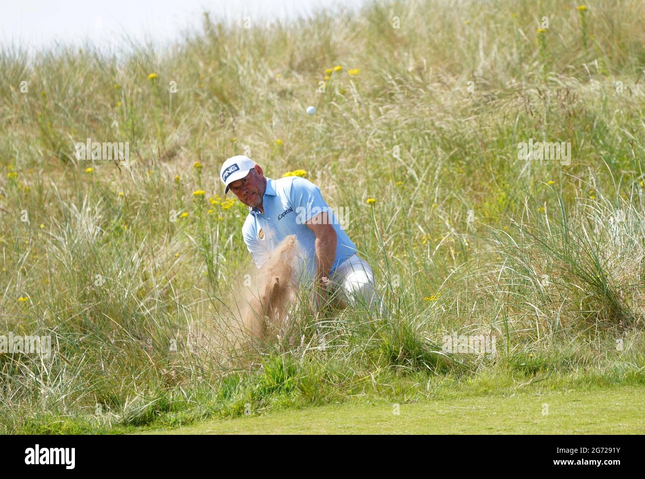 Lee Westwood chips on to the 11th green from the rough during day three ...