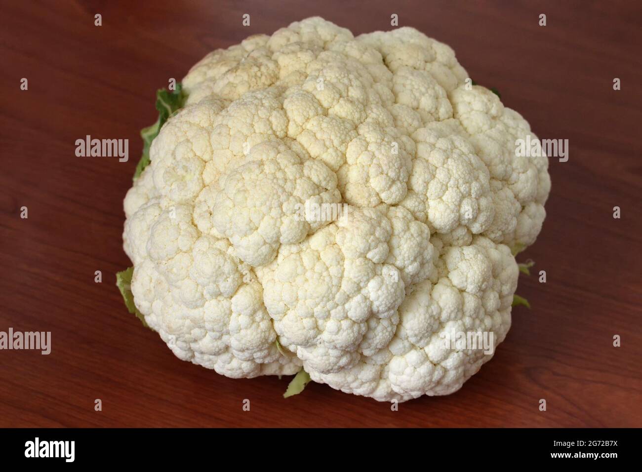 Fresh cauliflower on wooden background Stock Photo