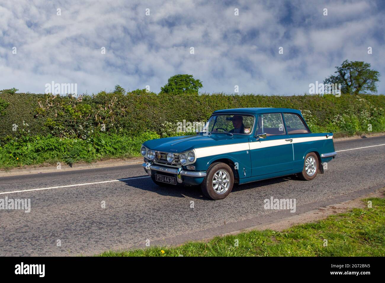 1970 70s blue Triumph Vitesse compact six-cylinder car built by Standard-Triumph 1996cc petrol 2dr en-route to Capesthorne Hall classic May car show, Cheshire, UK Stock Photo