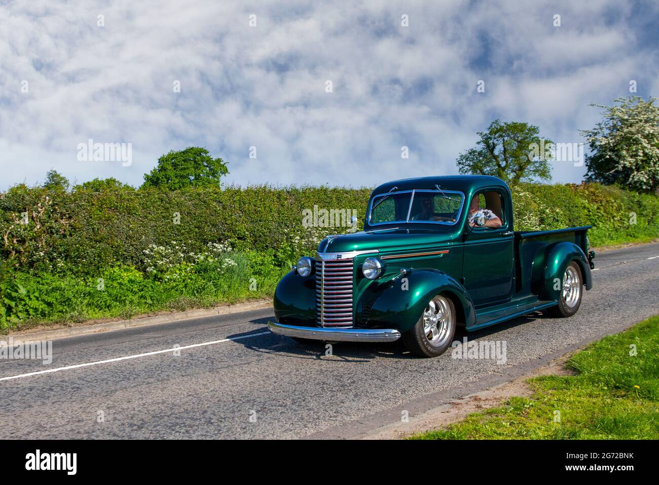1939 30s green Chevrolet 3-W Pickup American pick-up en-route to Capesthorne Hall classic May car show, Cheshire, UK Stock Photo