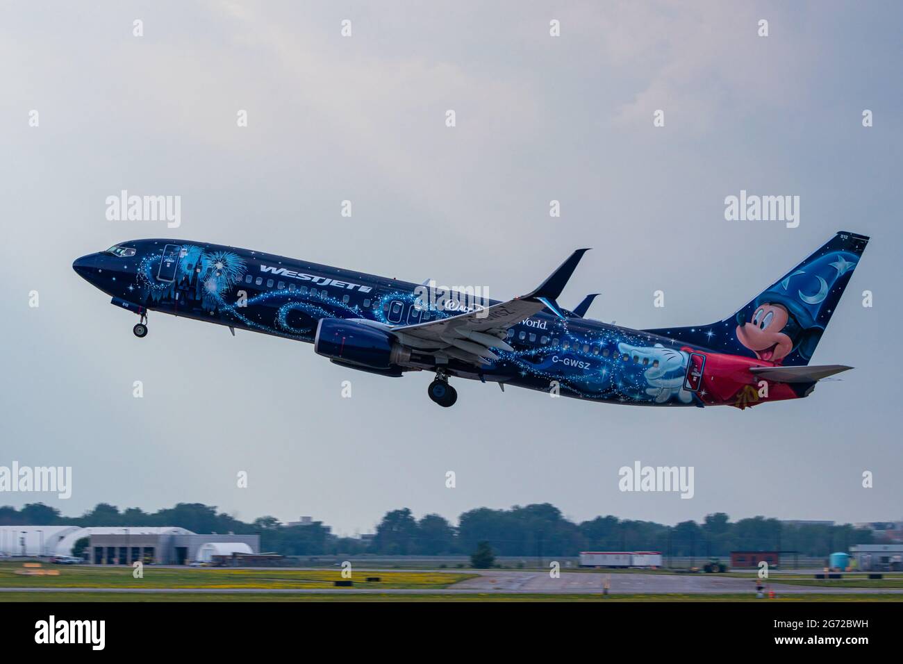Montreal, Quebec, Canada - 07 07 2021: Westjet's Walt Disney World livery on their 737-8CT taking off from Montreal. Registration C-GWSZ Stock Photo