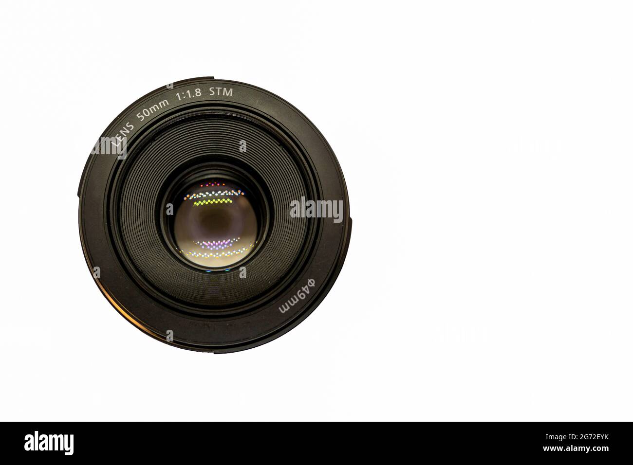 Top view of a 50mm professional optical lens for modern DSLR camera lens isolated on a white background. High resolution image. Copy paste text Stock Photo