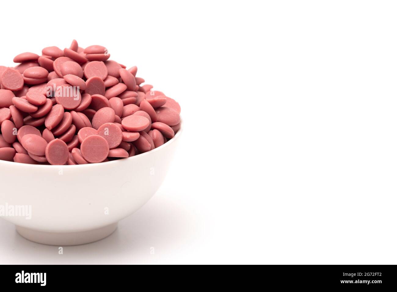 Authentic Ruby Chocolate Drops Isolated on a White Background Stock Photo