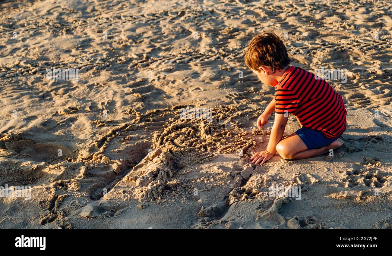 Children playing in the sand hi-res stock photography and images - Alamy