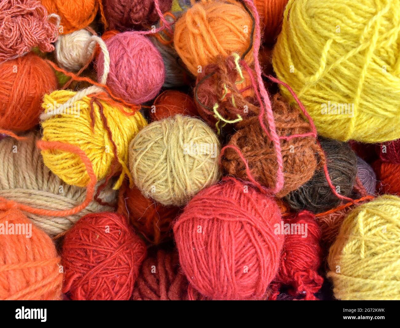 Bunch of colorful threads. Various colors and textures of wool balls ...