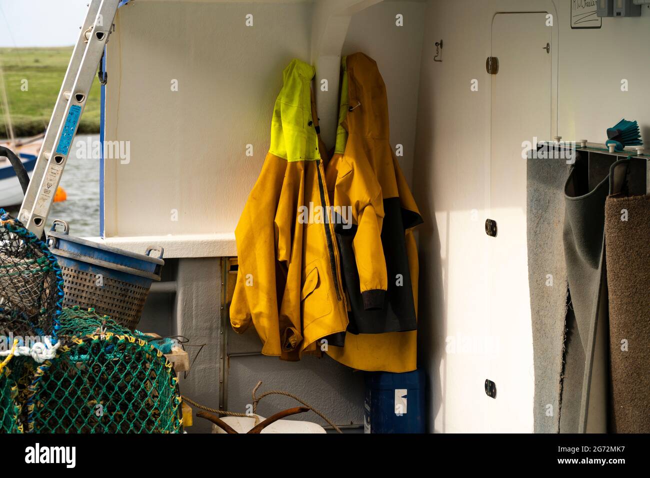 Coats Hanging Up High Resolution Stock Photography and Images - Alamy