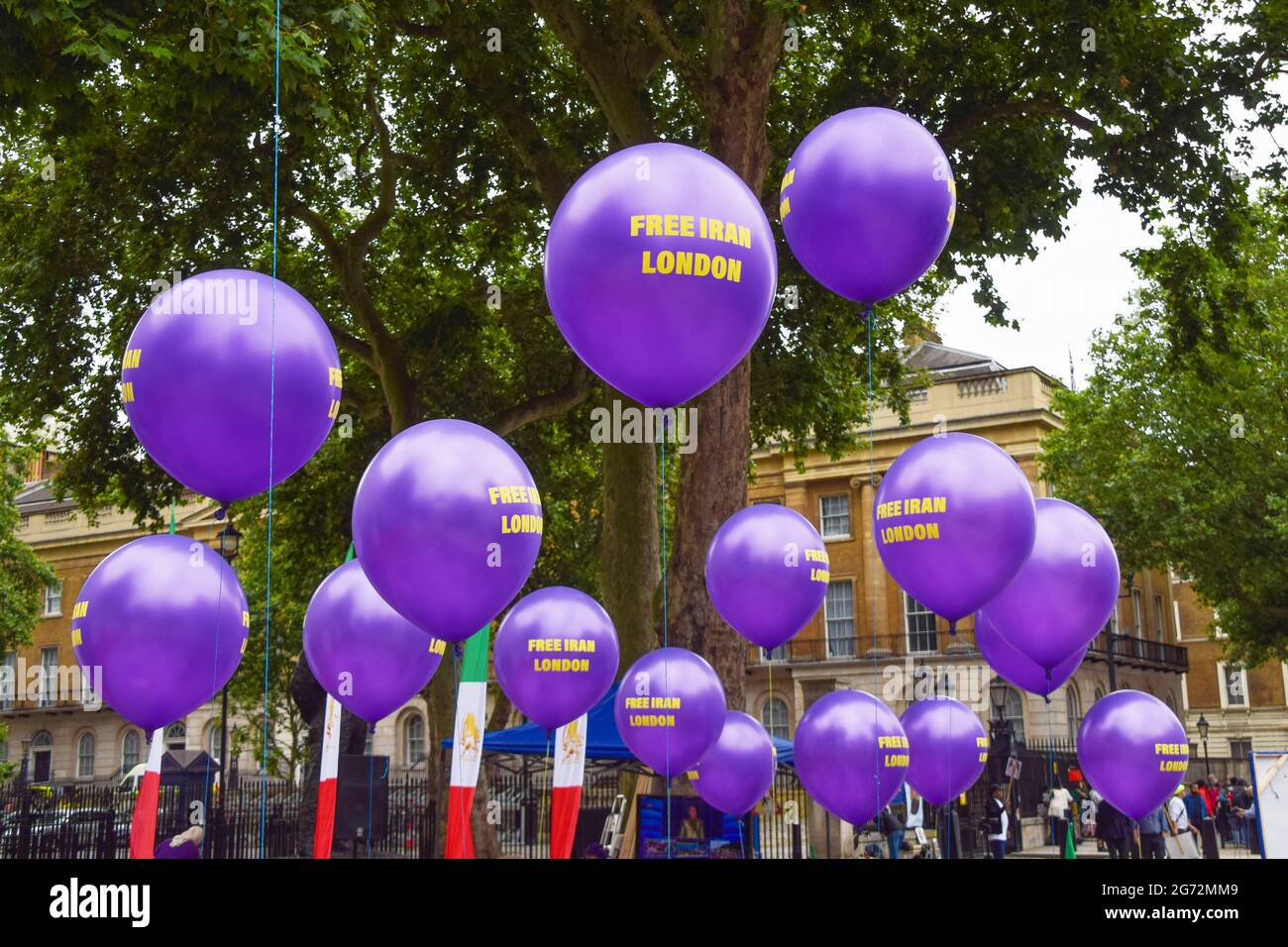 London, UK. 10th July, 2021. Balloons with the slogan 'Free Iran London' seen during the Free Iran World Summit in London. Demonstrators gathered outside Downing Street to protest against the Iran regime and in support of Maryam Rajavi, the leader of the People's Mujahedin of Iran (MEK). Credit: SOPA Images Limited/Alamy Live News Stock Photo