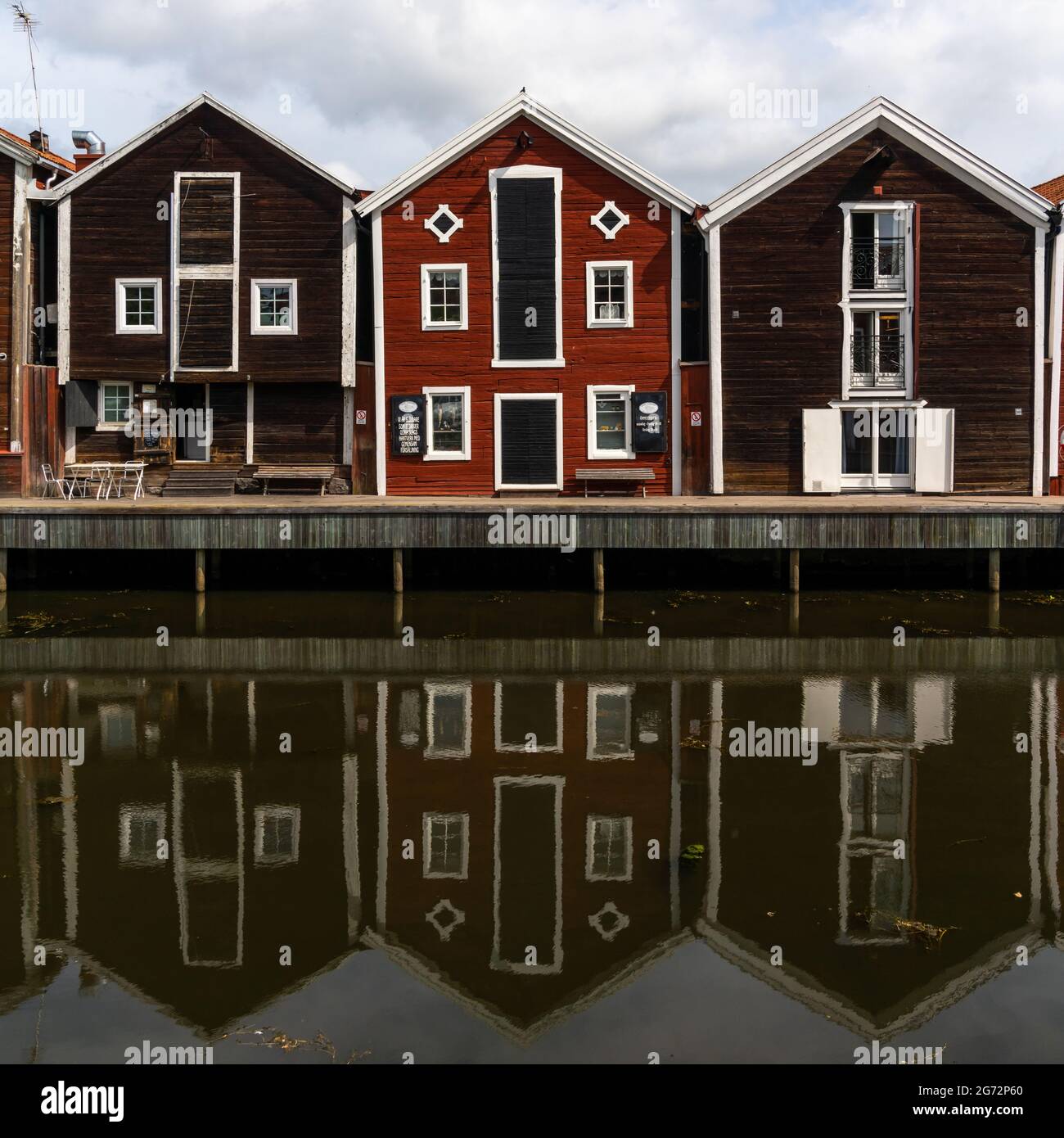Hudiksvall, Sweden - 7 July, 2021: red and brown wooden warehouses along the waterfront in Hudiksvall Stock Photo