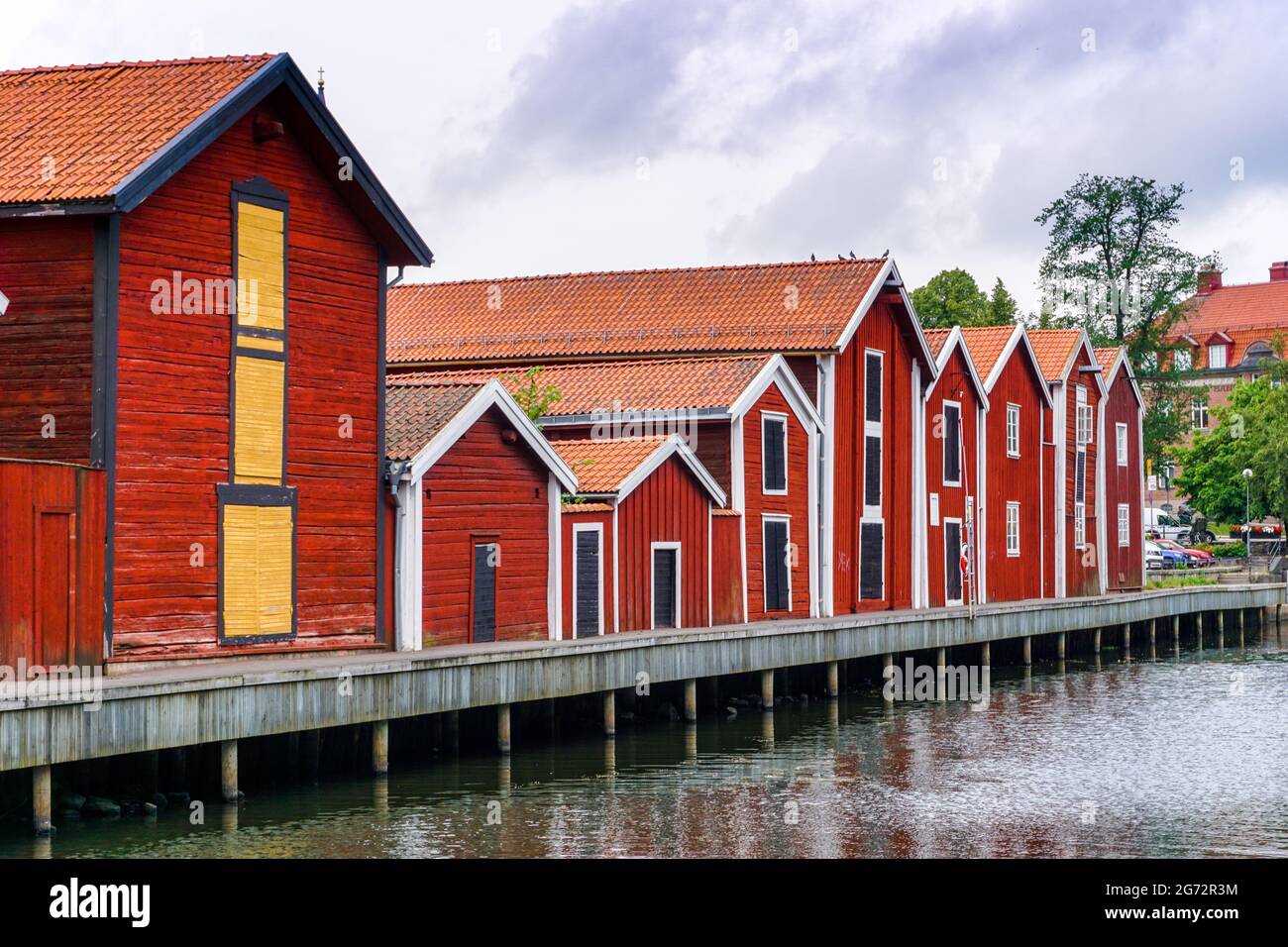 Hudiksvall, Sweden - 7 July, 2021: red and brown wooden warehouses along the waterfront in Hudiksvall Stock Photo
