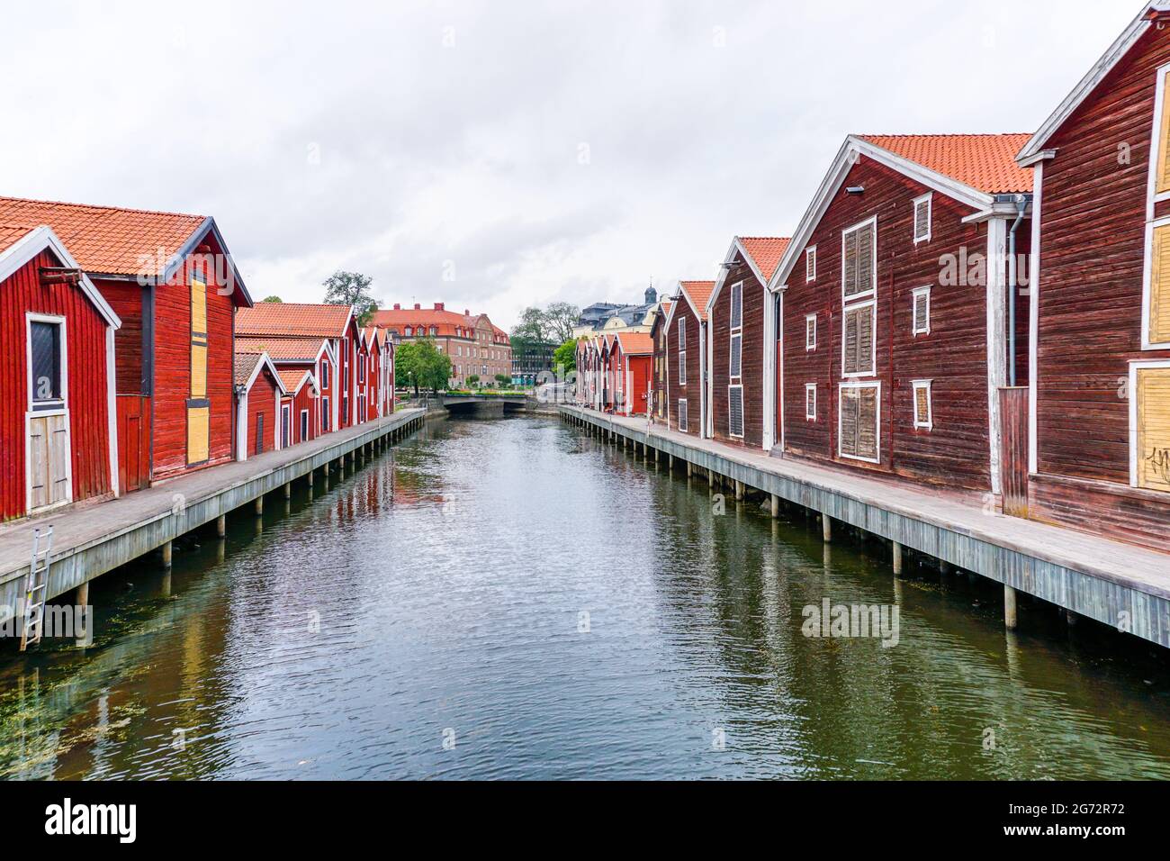 Hudiksvall, Sweden - 7 July, 2021: colorful wooden buildings line the canal in downtown Hudiskvall Stock Photo