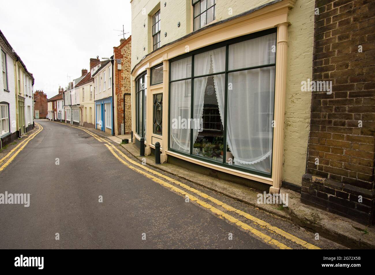 Narrow old fashioned high street Stock Photo - Alamy