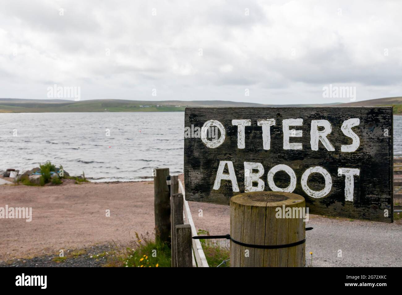 Otters Aboot sign at Tresta Voe on Shetland Mainland. Stock Photo