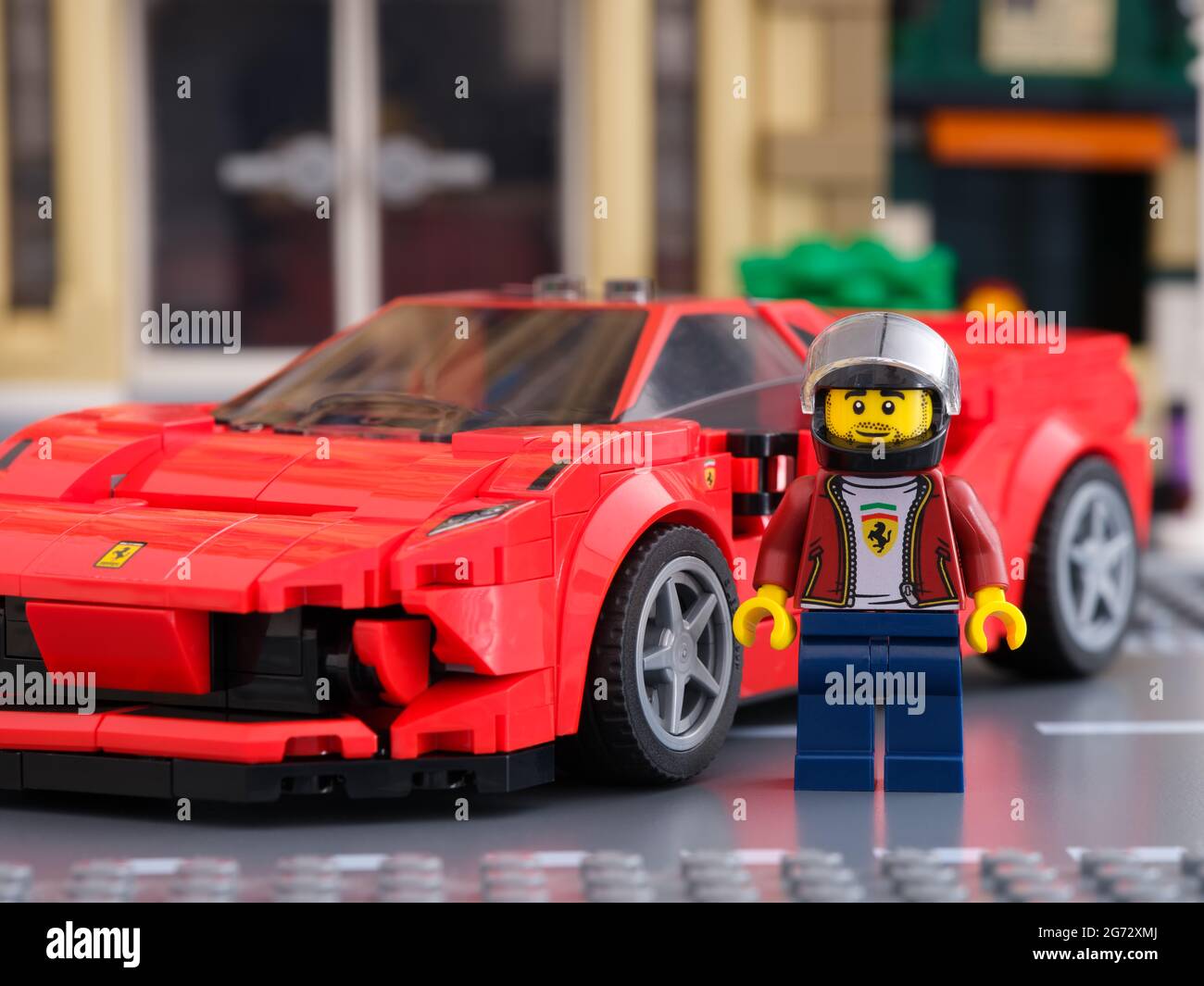 Tambov, Russian Federation - July 02, 2021 Lego driver minifigure near his car Ferrari F8 Tributo by LEGO Speed Champions. Stock Photo