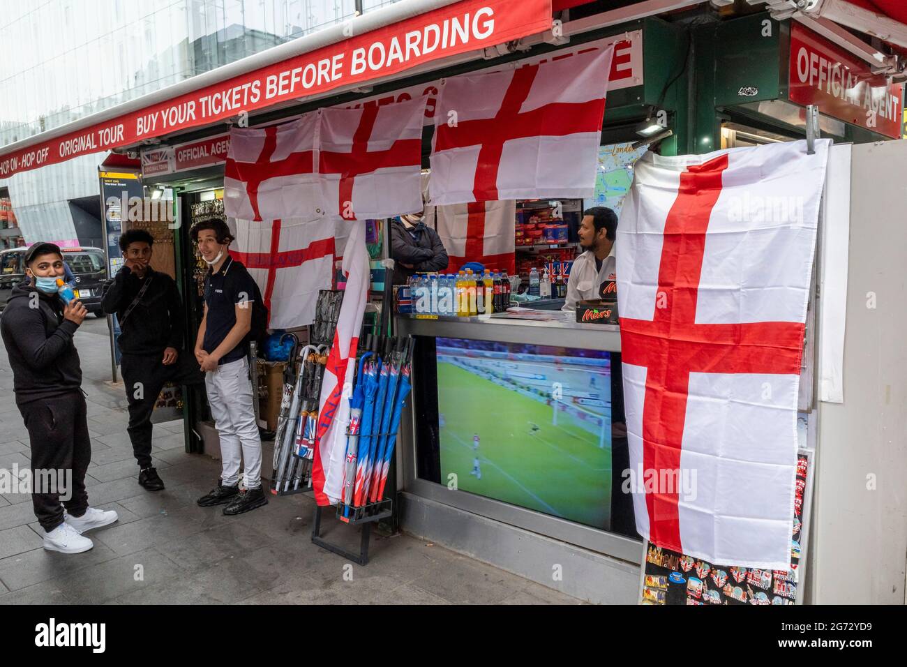 London, UK.  10 July 2021.  England flags decorate a sightseeing tour stand in Leicester Square ahead of the final of Euro 2020 between Italy and England tomorrow night Wembley Stadium.  It is the first major final that England will have played in since winning the World Cup in 1966 but Italy remain unbeaten in their last 33 matches.  Credit: Stephen Chung / Alamy Live News Stock Photo