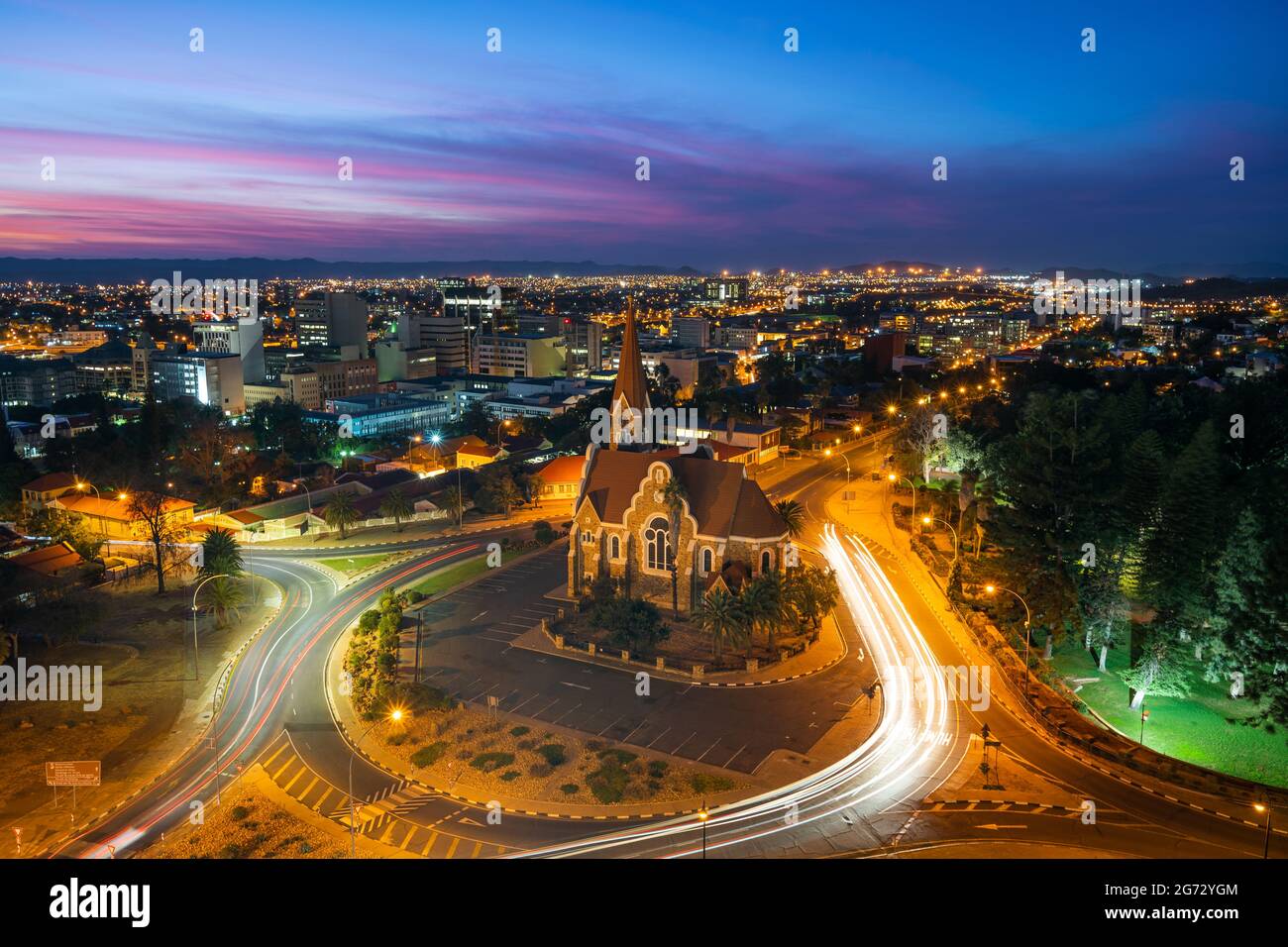 Historical landmark Christ Church aka Christuskirche at dusk in Windhoek, the capital and largest city of Namibia. Stock Photo
