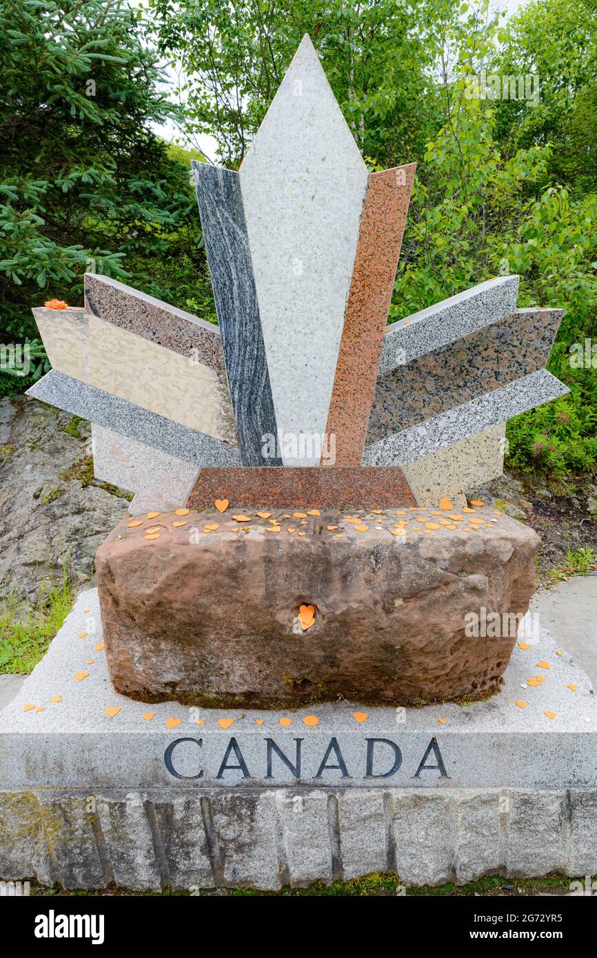 Saint John, NB, Canada - July 1, 2021: Orange hearts on the Canada stone, in memory of the Indigenous children who died in the residential schools. Stock Photo