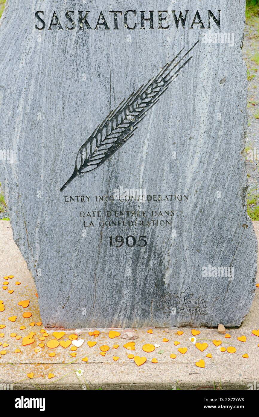 Saint John, NB, Canada - July 1, 2021: Orange hearts on the Saskatchewan stone, in memory of the Indigenous children who died in residential schools. Stock Photo