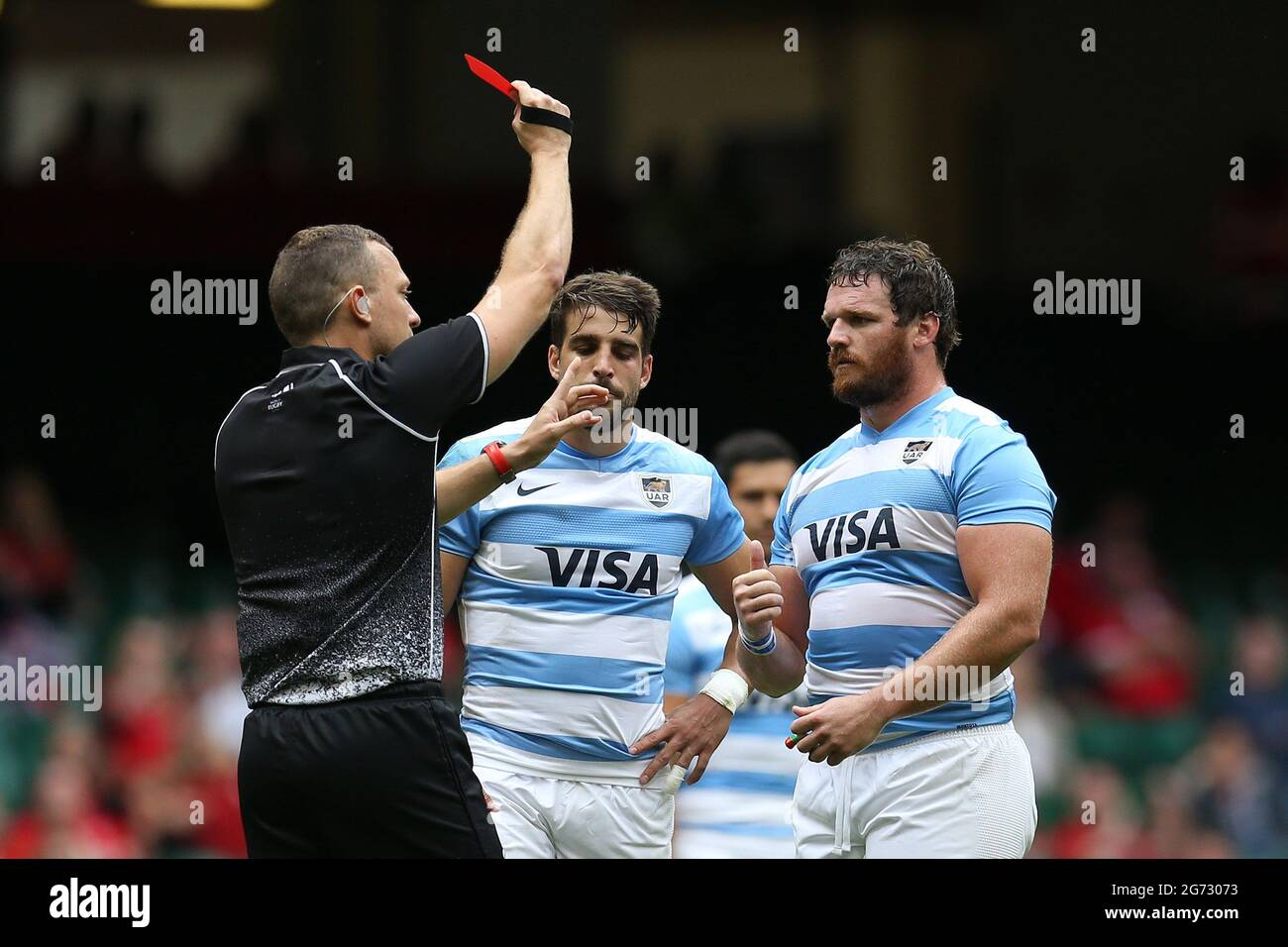 Cardiff, UK. 10th July, 2021. Juan Cruz Mallia of Argentina (c) is red carded and sent off by referee Matt Carley after he had high tackled Kieran Hardy of Wales. Rugby international friendly, Wales v Argentina, Summer series match at the Principality Stadium in Cardiff on Saturday 10th July 2021. pic by Andrew Orchard/Andrew Orchard sports photography Credit: Andrew Orchard sports photography/Alamy Live News Stock Photo