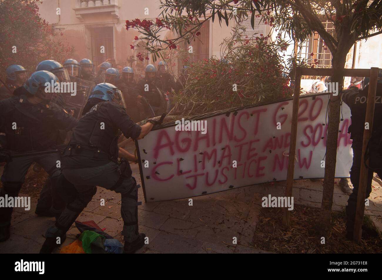 Venice, Italy. 10th July, 2021. Protestors and police clash during the demonstration 'We are the tide, you are only (G)20' on July 10, 2021 in Venice, Italy. For their third meeting under the Italian G20 presidency, on 9 and 10 July 2021, G20 Finance Ministers and Central Bank Governors (FMCBG) gathered in Venice for a two-day summit on issues related to global economy and health © Simone Padovani / Awakening / Alamy Live News Stock Photo