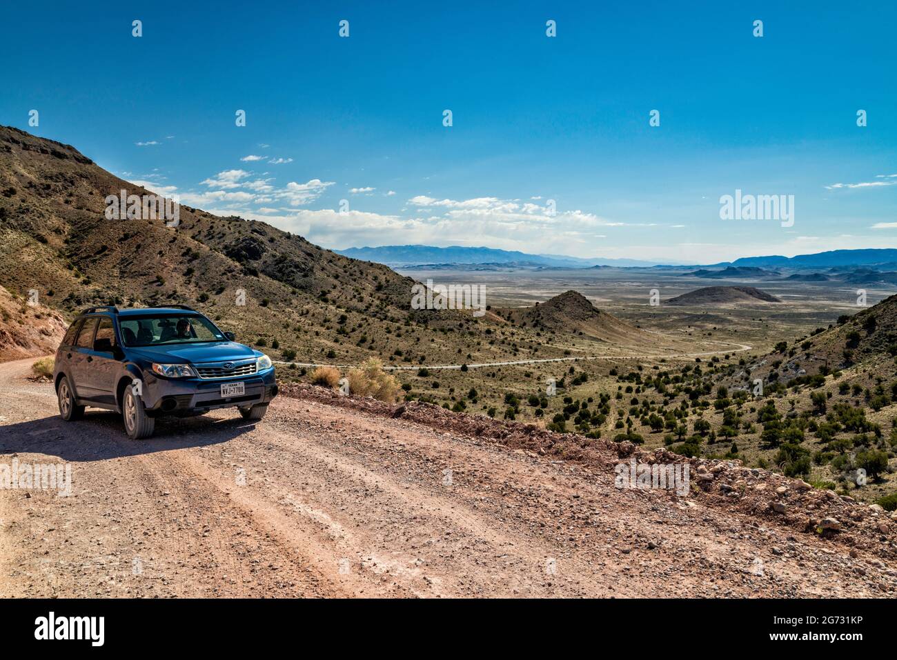SUV at Pony Express Trail, Back Country Byway, view from Dugway Pass in Dugway Range, Great Basin, Utah, USA Stock Photo