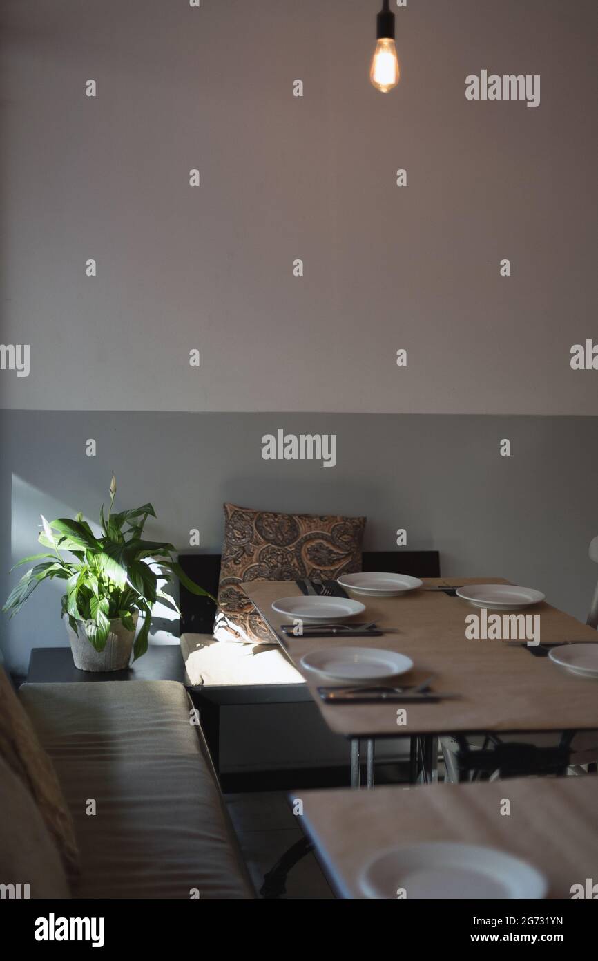 cozy place. a table inside an Italian restaurant with serving plates