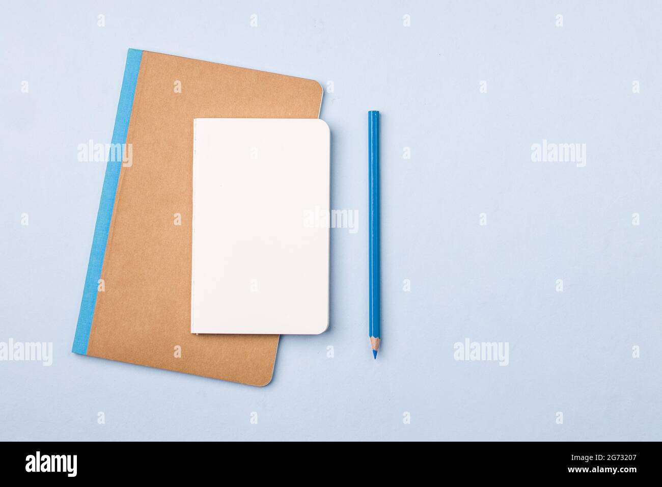 Empty notebook ready for mockup on blue table, top view, flatlay Stock ...