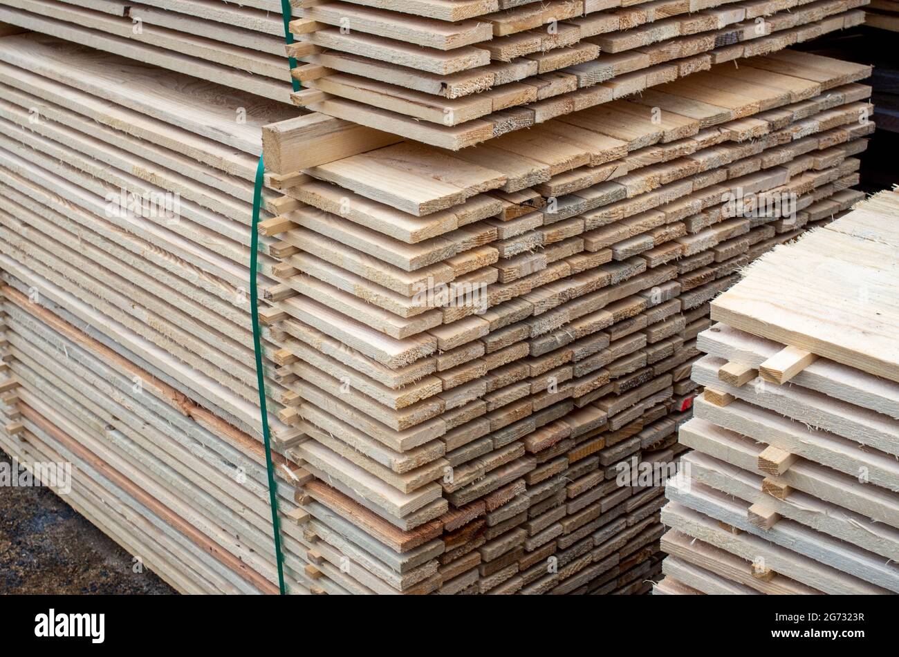 large stacks of wooden planks at the building material depot Stock