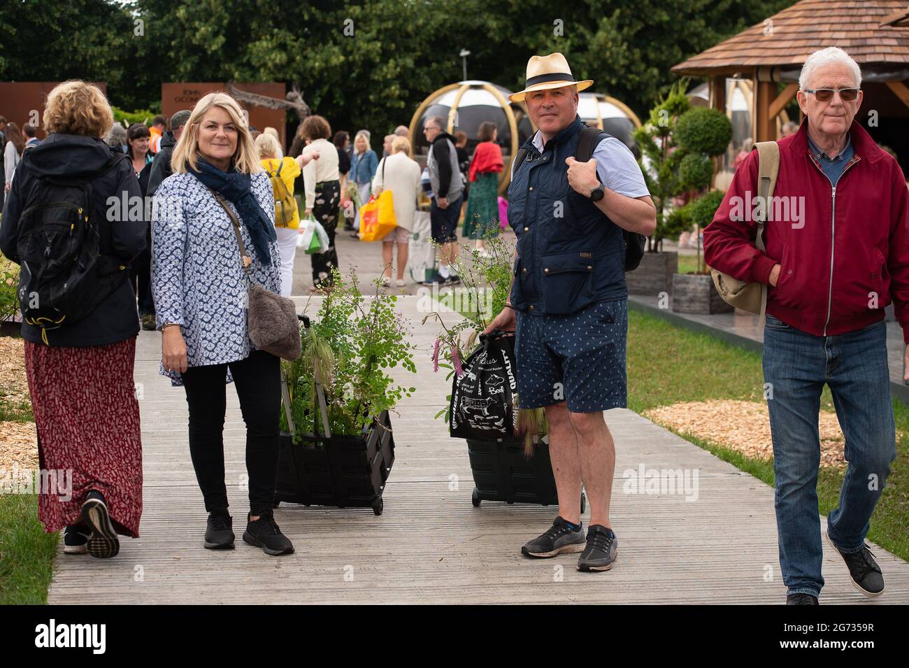 East Molesey, Surrey, UK. 8th July, 2021. People buying plants to take home on Day 4 of the RHS Hampton Court Palace Garden Festival. Credit: Maureen McLean/Alamy Stock Photo