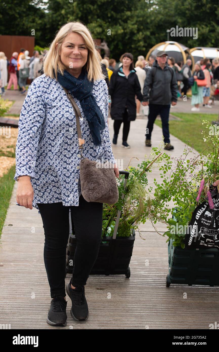 East Molesey, Surrey, UK. 8th July, 2021. People buying plants to take home on Day 4 of the RHS Hampton Court Palace Garden Festival. Credit: Maureen McLean/Alamy Stock Photo