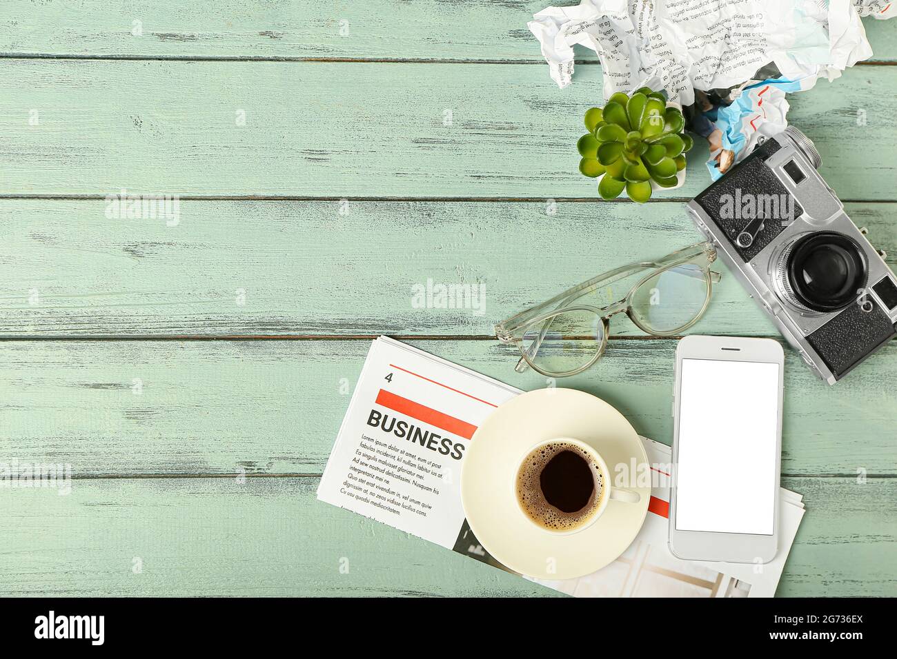 Composition with newspaper and mobile phone on color wooden background Stock Photo