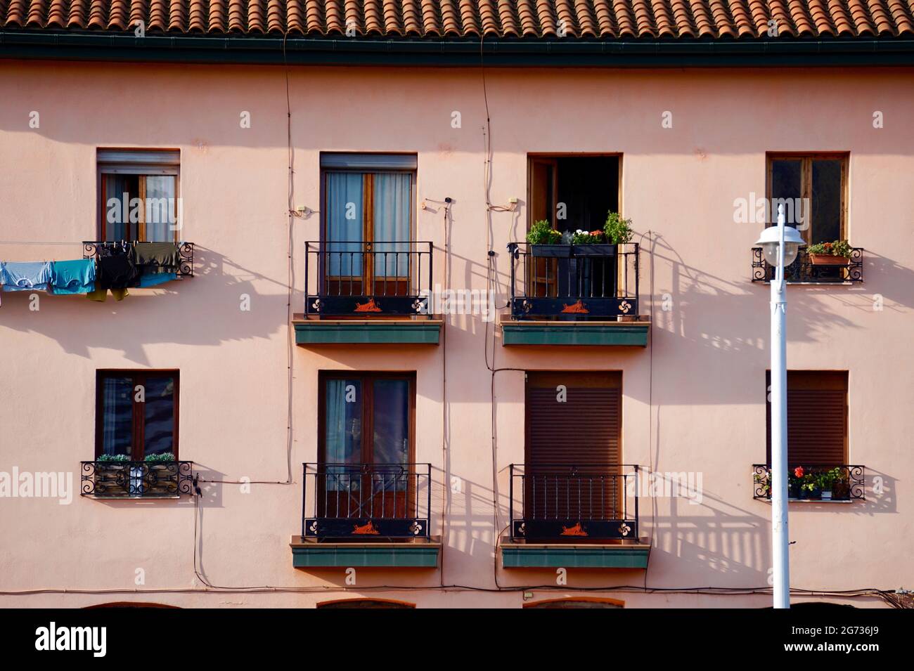 Balconies on the facade of the pink house in Bilbao city, Spain Stock ...