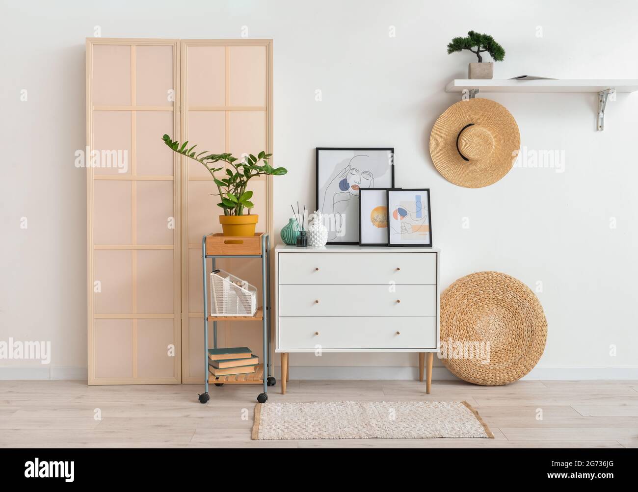 Interior of stylish living room with pictures Stock Photo - Alamy