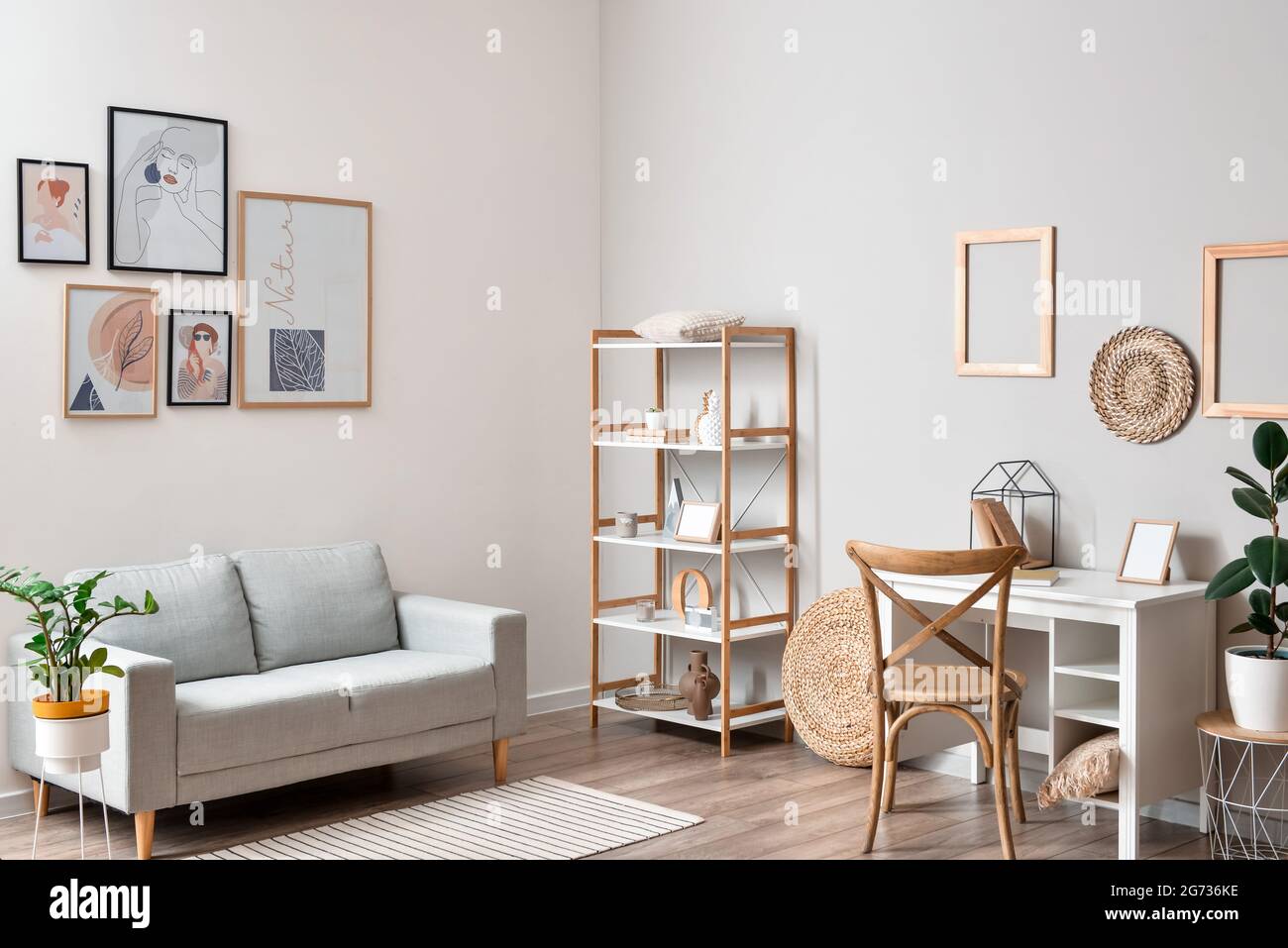 Interior of stylish living room with pictures Stock Photo - Alamy