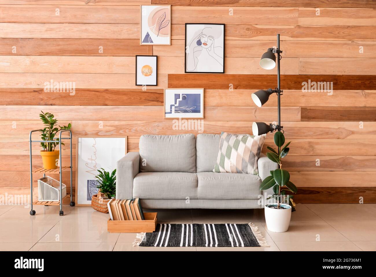 Interior of stylish living room with pictures Stock Photo - Alamy