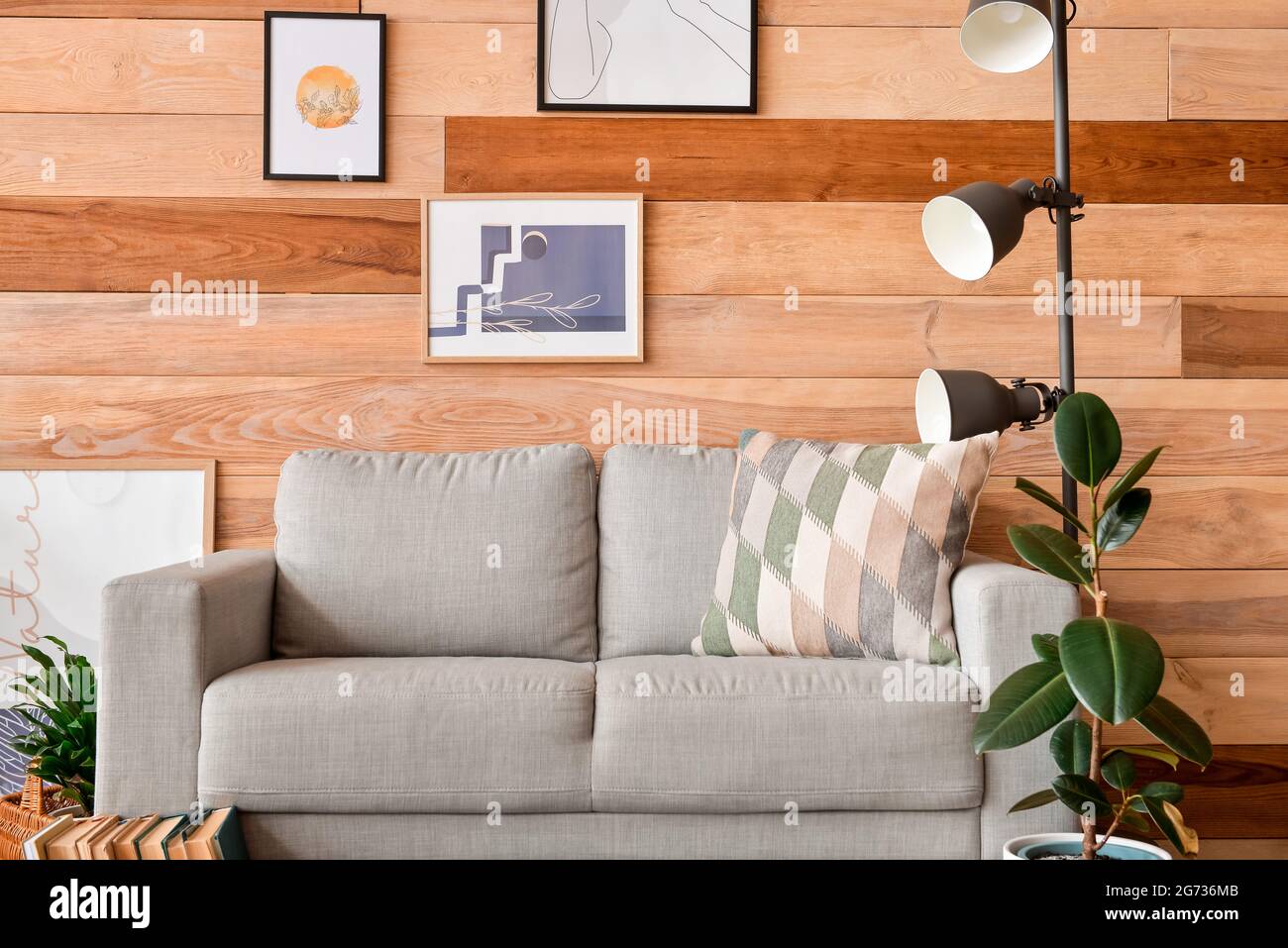 Interior of stylish living room with pictures Stock Photo - Alamy