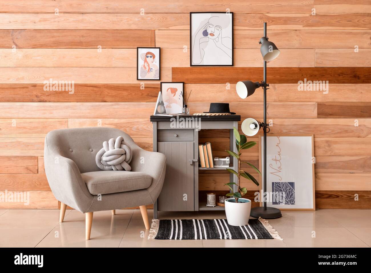 Interior of stylish living room with pictures Stock Photo - Alamy